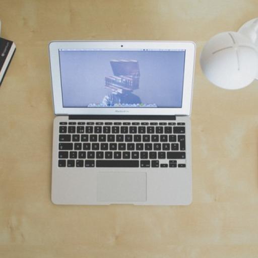 A computer on a desk.